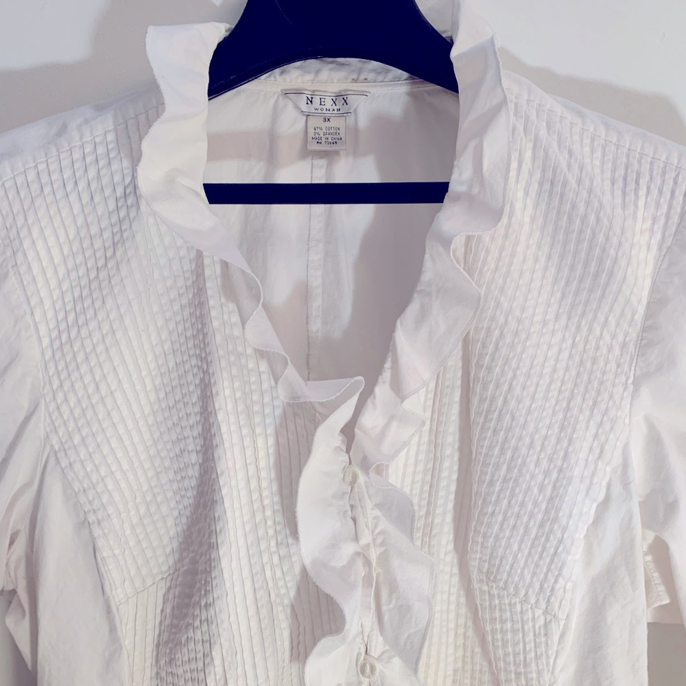 Frilly cotton blouse.